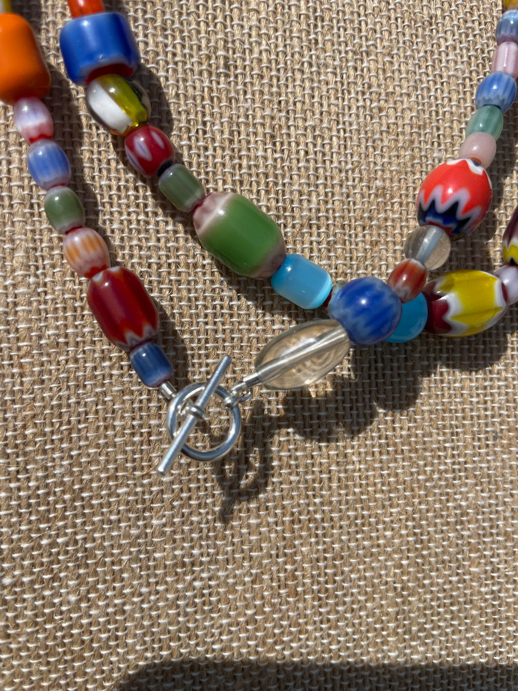Passage
Collected Glass Strand · 17 inches